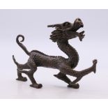 A bronze model of a dragon. 11 cm long.