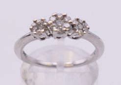 A 9 K white gold diamond ring. Ring size N/O.