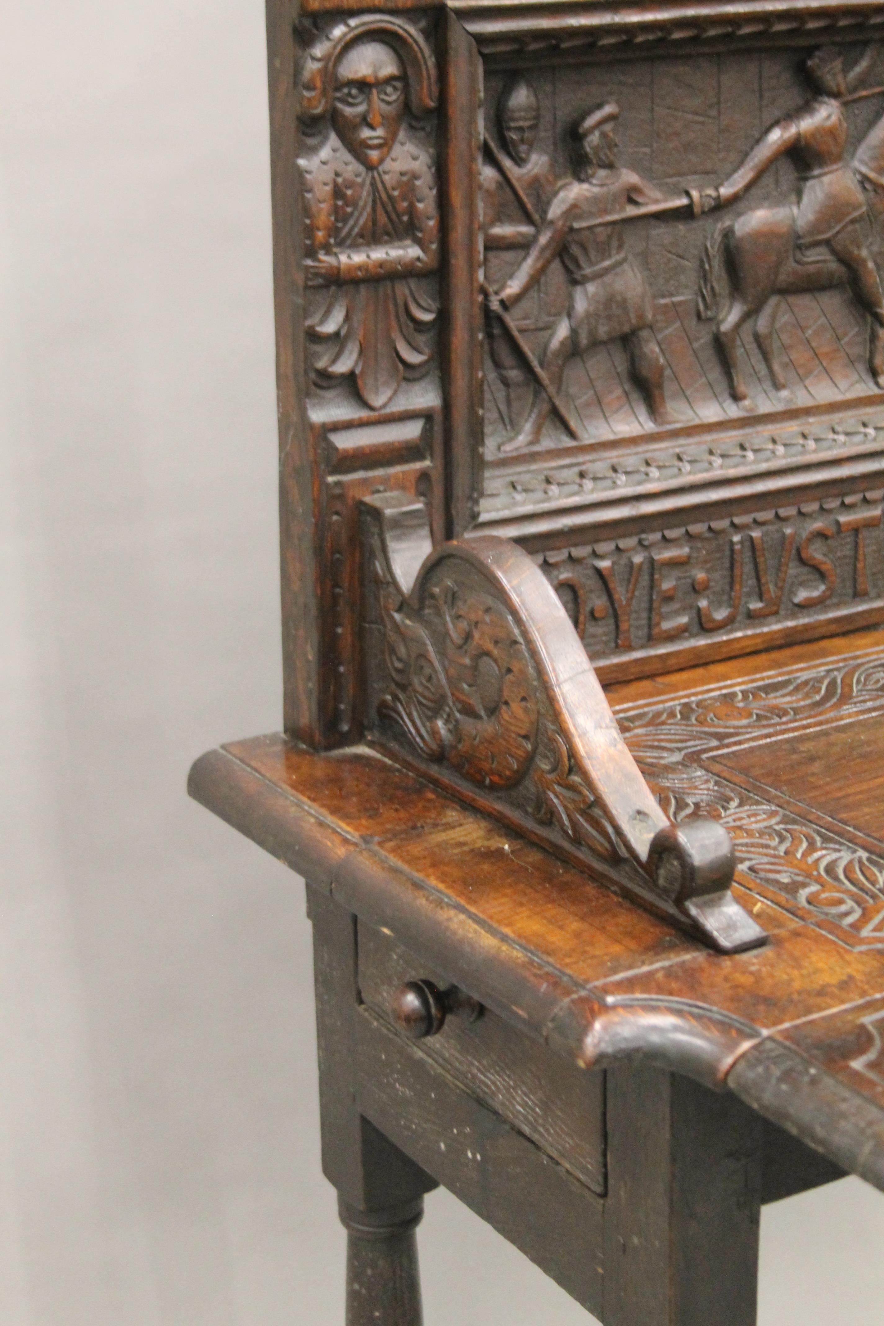 A carved oak single flap side table, the back carved with a scene titled Do Ye Justyce Unto All. - Image 6 of 8