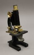 An R & J Beck Ltd London microscope in mahogany carrying case. The case 33 cm high.