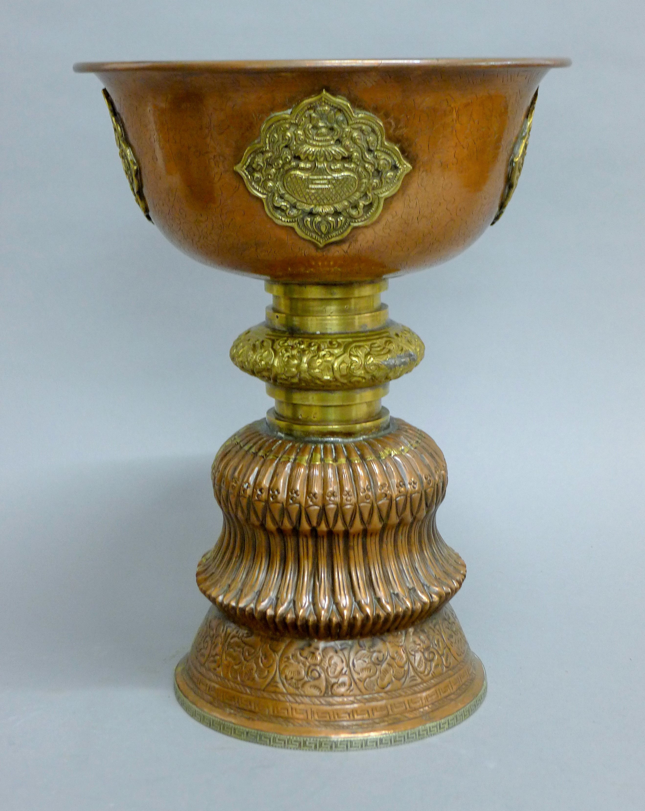 A late 19th century large Tibetan copper and brass butter lamp with silver base rim. - Image 2 of 5