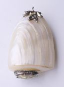 A mother-of-pearl snuff bottle. 9 cm high.