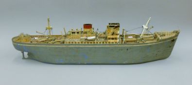 A vintage metal Scratch Built model ship named The Penang. 93 cm long.