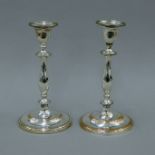 A pair of silver-plated candlesticks. 28 cm high.