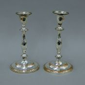 A pair of silver-plated candlesticks. 28 cm high.