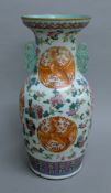 A Chinese porcelain vase decorated with phoenix and dragons. 46 cm high.