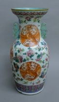 A Chinese porcelain vase decorated with phoenix and dragons. 46 cm high.