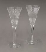 A pair of boxed Waterford crystal champagne flutes. 23 cm high.