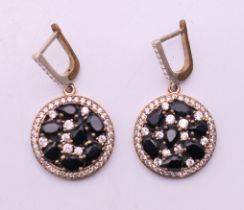 A pair of silver gilt sapphire and cubic zirconia earrings. 2 cm diameter.