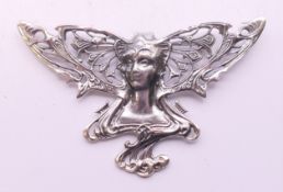 A silver Art Nouveau style girl brooch. 7.5 cm wide.