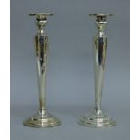 A pair of Chinese silver candlesticks. 25.5 cm high. 21.6 troy ounces (loaded).