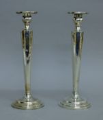 A pair of Chinese silver candlesticks. 25.5 cm high. 21.6 troy ounces (loaded).
