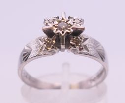 An 18 ct white gold diamond ring. Ring size P.