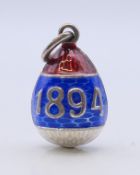 A 1794-1894 silver egg pendant bearing Russian marks. 2.5 cm high.