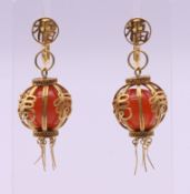 A pair of 14 ct gold Chinese lantern form earrings. 4 cm high overall. 14.1 grammes total weight.