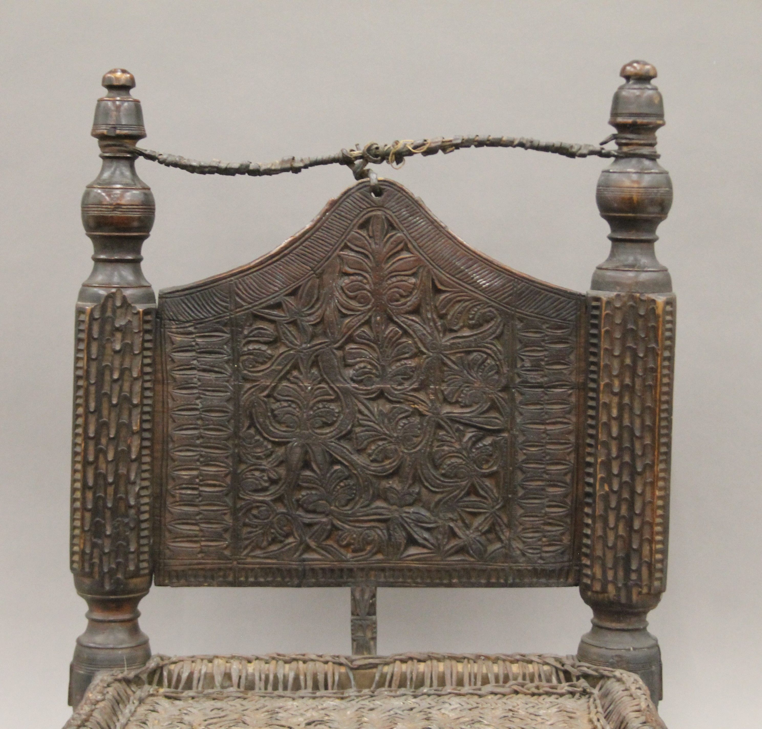 An Indian antique low hardwood chair with reeded seating. 64 cm high. - Image 5 of 5