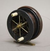 A rare early 20th century 3 1/2 inch Coxon 'Aerial' walnut and ebonite fishing reel with six spoke