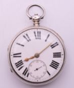 A gentleman's silver pocket watch, hallmarked for London 1874. 5 cm diameter.