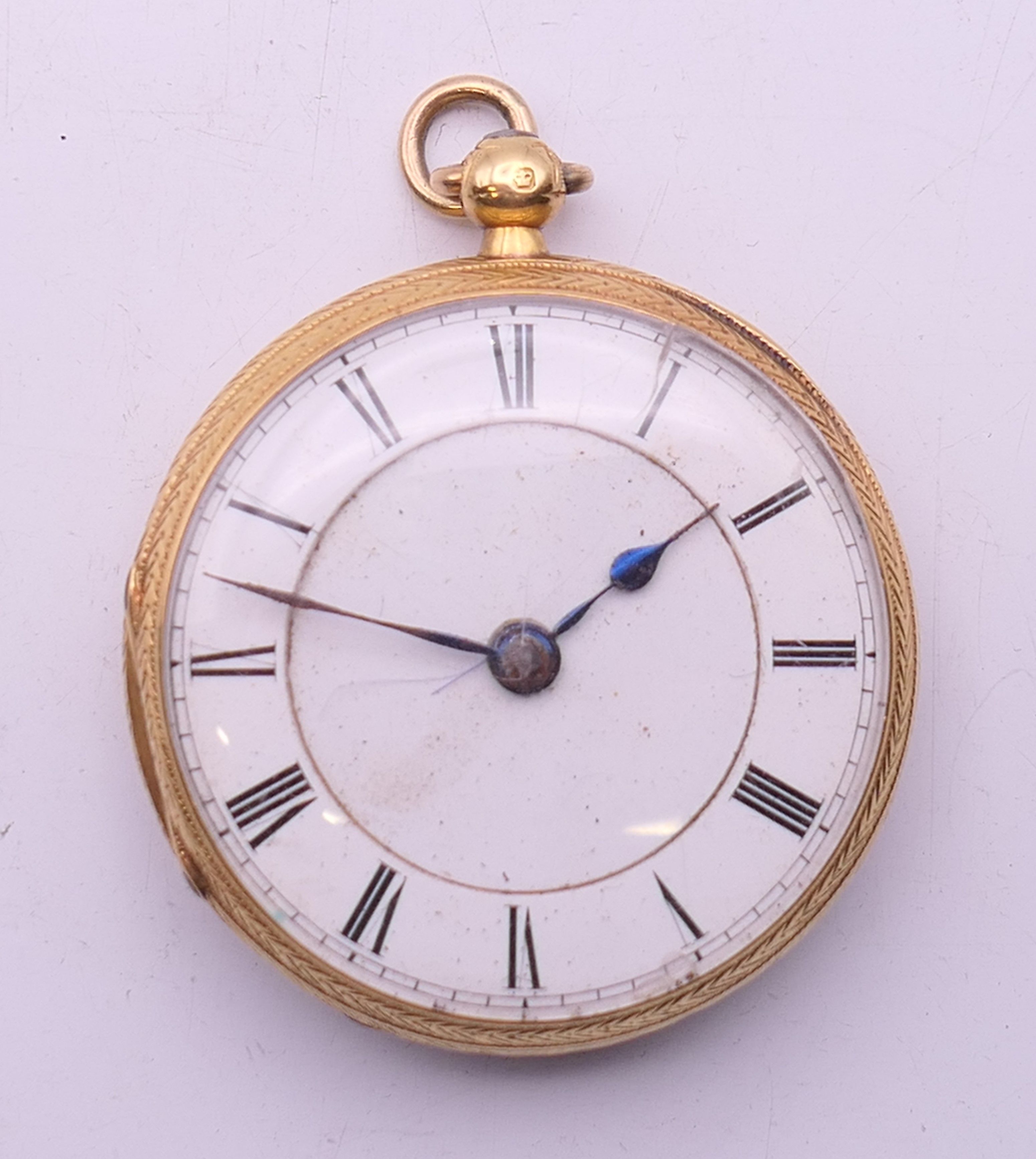 An 18 K gold open-faced pocket watch. 4 cm diameter. 61.8 grammes total weight.