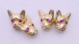 A pair of silver gilt cufflinks formed as French bulldog heads bearing Russian marks. 1.5 cm high.