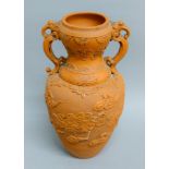 A large Chinese red clay vase (probably Yixing) decorated with dragons in clouds,