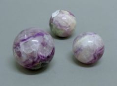 Three mineral balls. The largest 5.5 cm high.