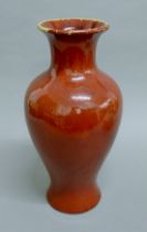 A Chinese sang de boeuf pottery vase. 38.5 cm high.