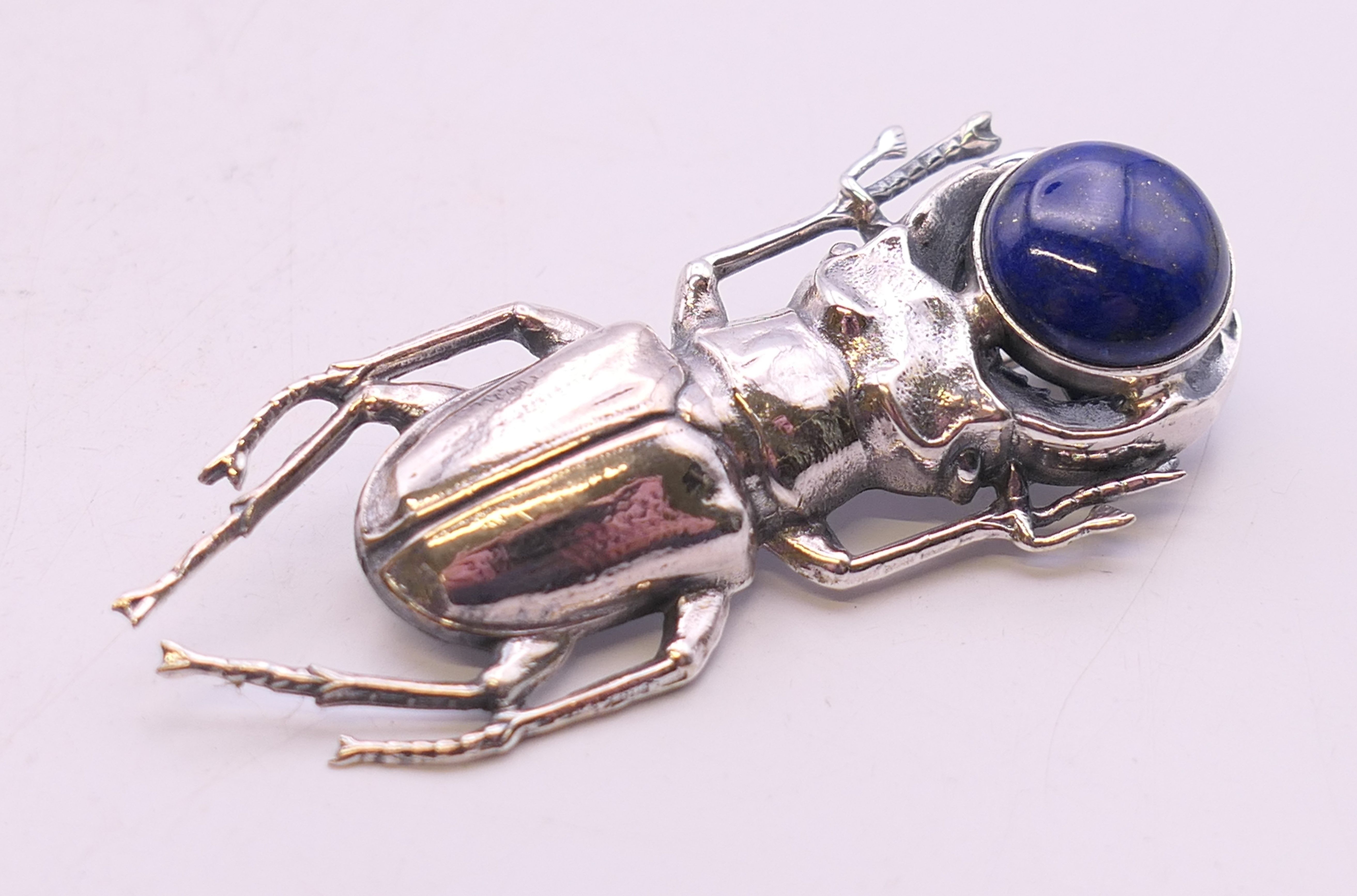 A silver and lapiz beetle brooch. 5.5 cm long. - Image 2 of 4