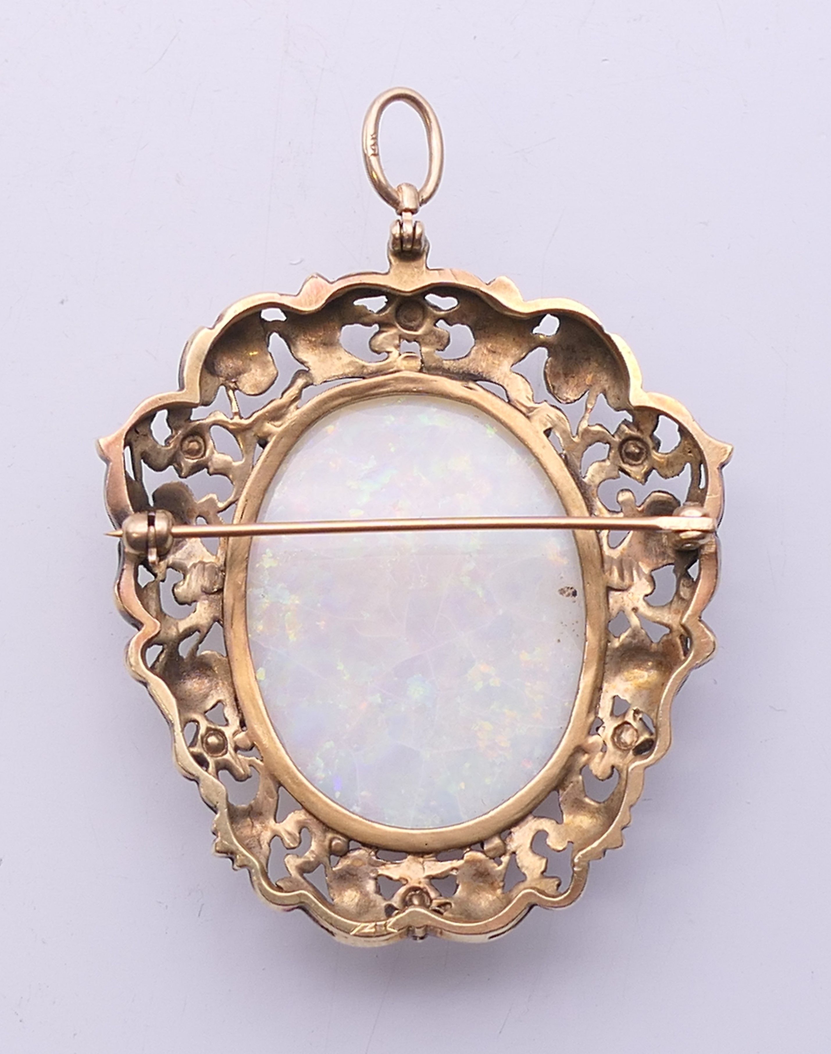 A large opal and gold brooch. 5.5 cm high overall. 15.4 grammes total weight. - Image 3 of 4