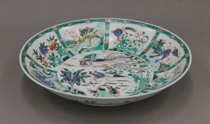 A large 18th/19th century Chinese famille verte porcelain charger. 42.5 cm diameter.