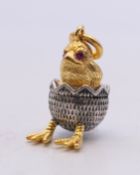 A silver hatching chick pendant bearing Russian marks. 2.5 cm high.