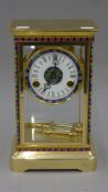 A cloisonne brass four-glass clock. 29.5 cm high.