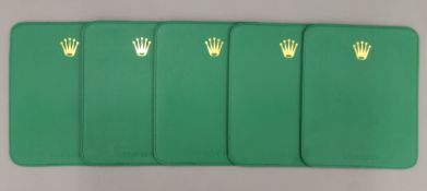 Five Rolex placemats. 19.5 x 23.5 cm.