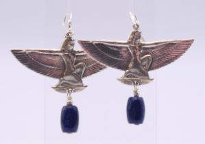 A pair of silver and lapiz Egyptian revival earrings. 5 cm wide.