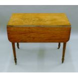 A 19th century mahogany Pembroke table. 84 cm long.