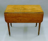 A 19th century mahogany Pembroke table. 84 cm long.