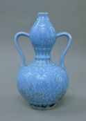 A Chinese blue double gourd vase. 30 cm high.