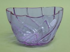 An amethyst glass jelly mould. 20 cm long.