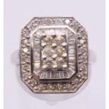 A 14 K white gold square diamond cluster ring. Ring size N/O.