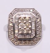 A 14 K white gold square diamond cluster ring. Ring size N/O.