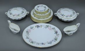 A Royal Worcester June Garland pattern dinner service, comprising eight dinner plates,