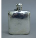 A silver spirit flask, hallmarks for Chester 1927, the front with presentation inscription. 8.