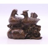 A bronze model of two ducks. 5.5 cm long.