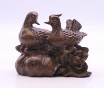 A bronze model of two ducks. 5.5 cm long.