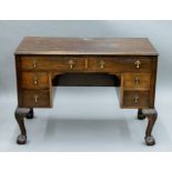 An early 20th century walnut desk. 102 cm wide, 50 cm deep.