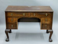 An early 20th century walnut desk. 102 cm wide, 50 cm deep.