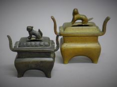Two small lidded rectangular bronze censers. The largest 9.5 cm wide.