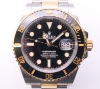 A boxed Rolex gentleman's Oyster Perpetual Date Submariner wristwatch with black bezel. 4.