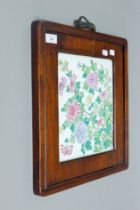 A florally-decorated Chinese porcelain plaque in hardwood frame. 38 x 42 cm overall.