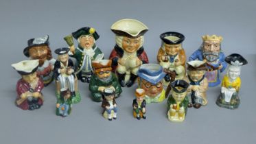 A selection of character jugs. The largest 16.5 cm high.